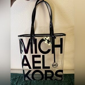GENTLY USED …… MICHAEL KORS CLEAR BLACK LOGO TOTE